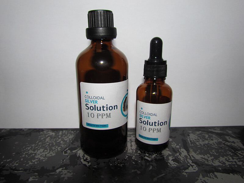A glass bottle of The Silver Lab's premium silver solution